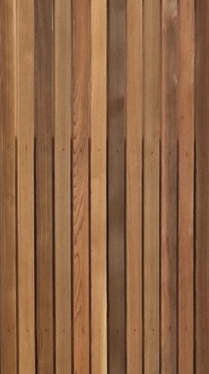 Vertical Western red cedar boards in warm orange and brown tones.